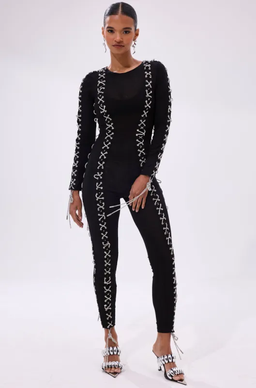 LACE IT UP MESH JUMPSUIT WITH RHINESTONE DETAIL sold by AKIRA
