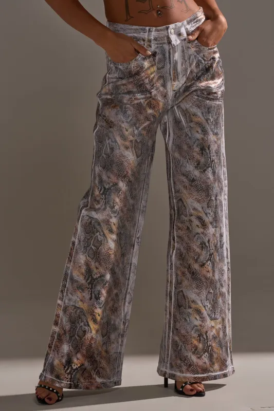 ADDICTED TO YOU METALLIC SNAKE WIDE LEG DENIM sold by AKIRA
