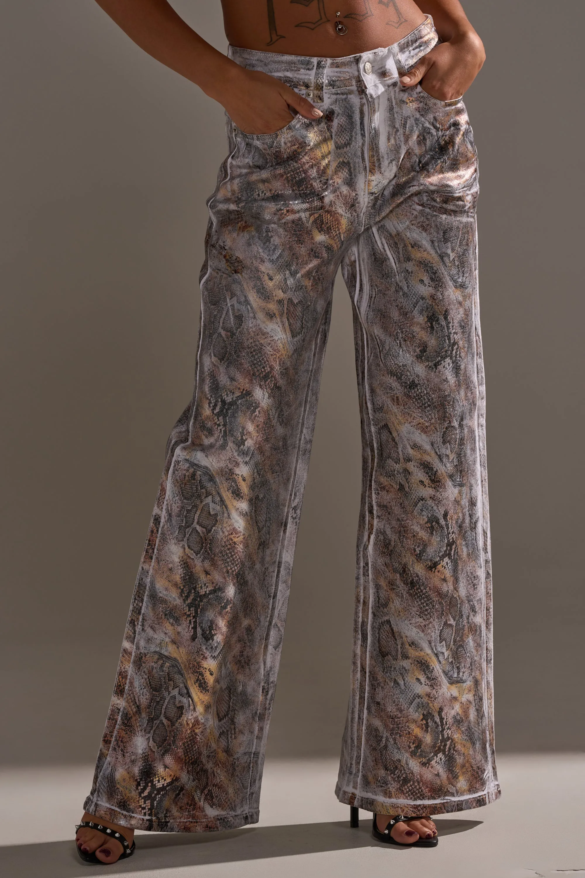 ADDICTED TO YOU METALLIC SNAKE WIDE LEG DENIM sold by AKIRA
