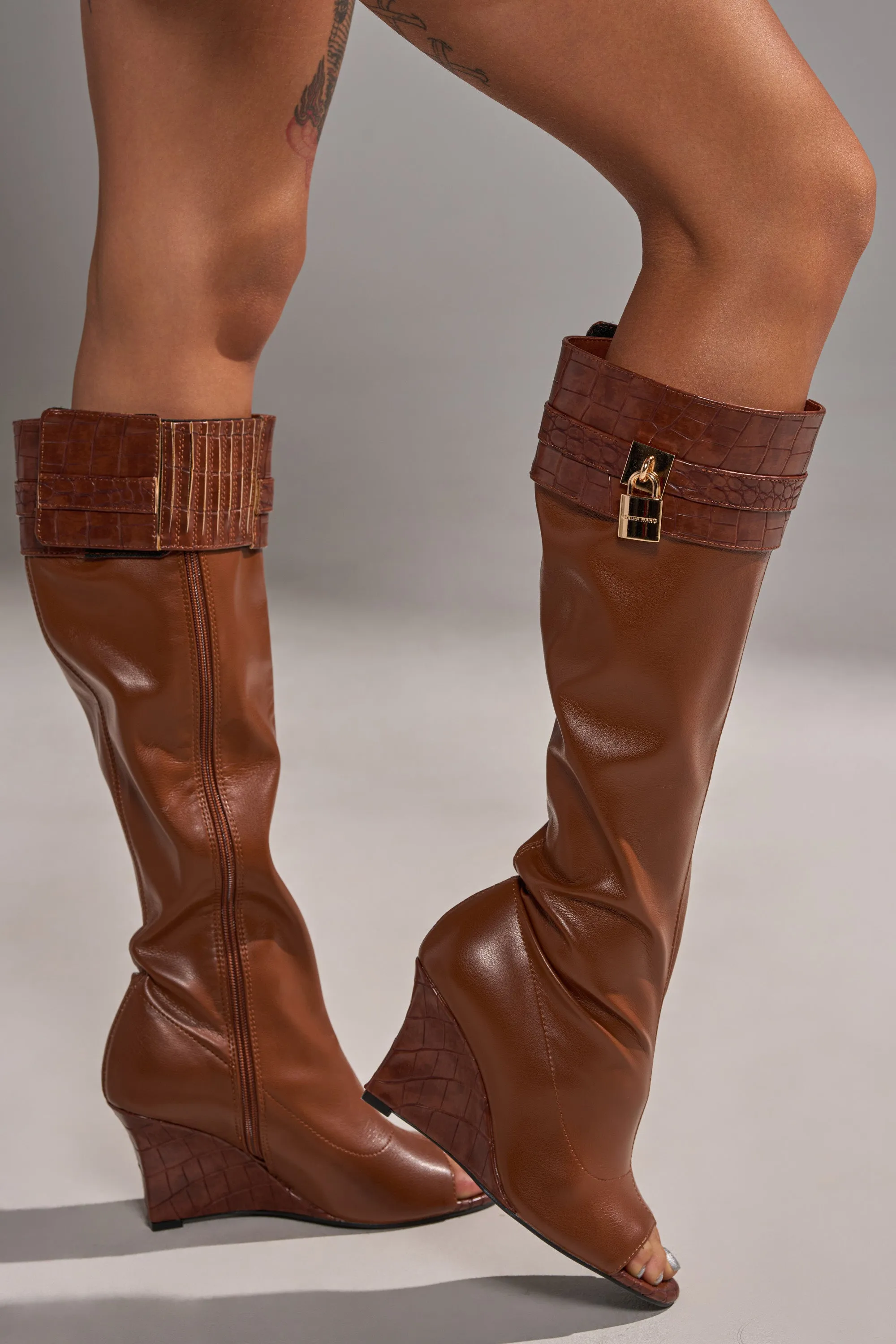 AZALEA WANG GLENNA COGNAC STRETCH PU WEDGE BOOT sold by AKIRA