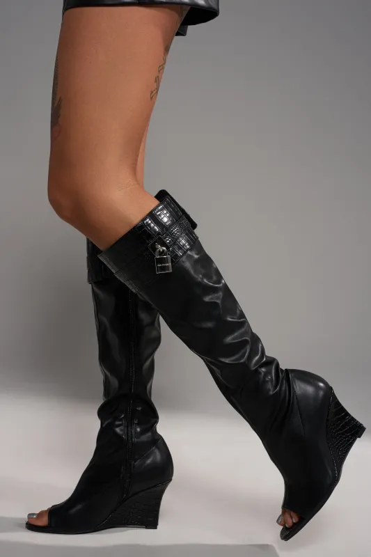AZALEA WANG GLENNA BLACK STRETCH PU WEDGE BOOT sold by AKIRA