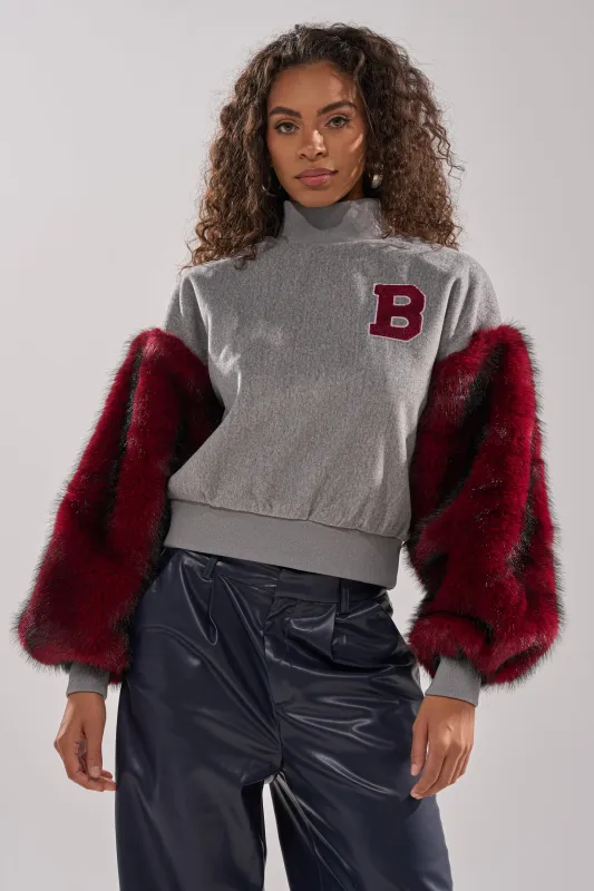NEW EAST SIDE FAUX FUR SLEEVE SWEATSHIRT sold by AKIRA