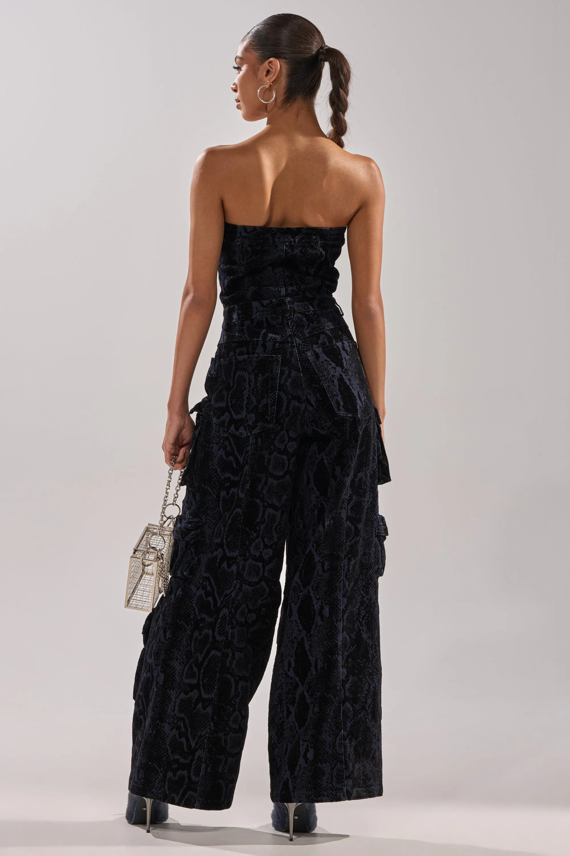 CAUGHT YOUR EYE VELVET DENIM JUMPSUIT IN SNAKEPRINT sold by AKIRA product image thumbnail 4