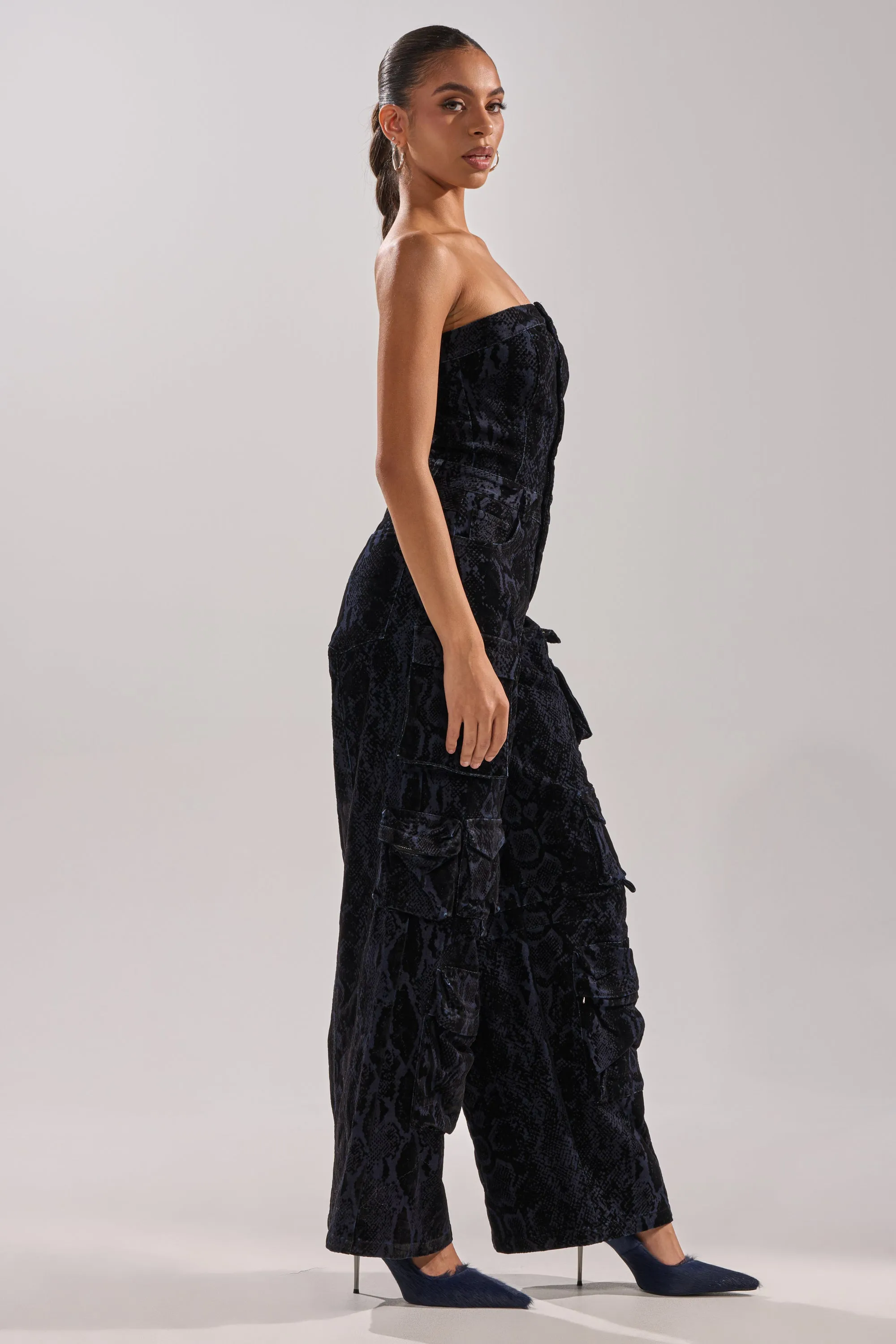 CAUGHT YOUR EYE VELVET DENIM JUMPSUIT IN SNAKEPRINT sold by AKIRA product image thumbnail 3