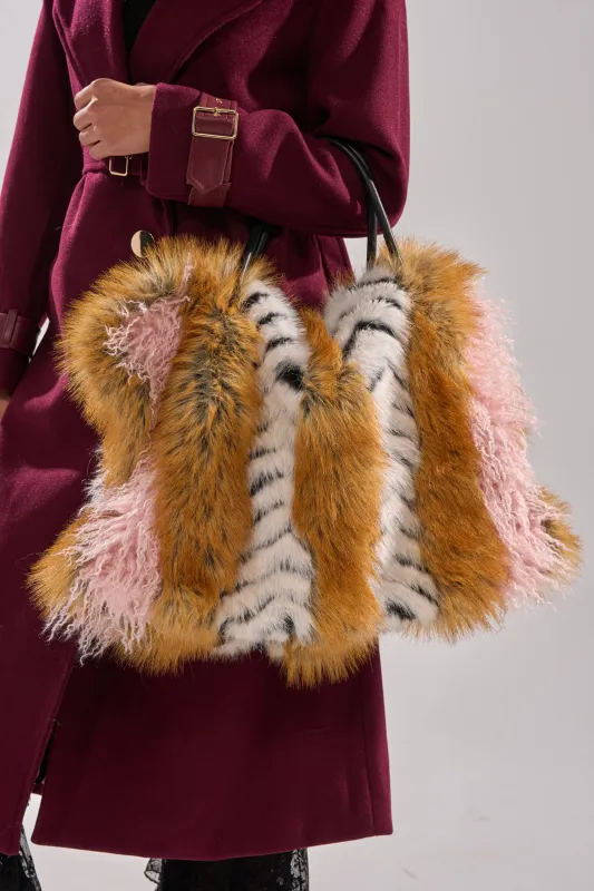 WILD ONE FAUX FUR TOTE sold by AKIRA