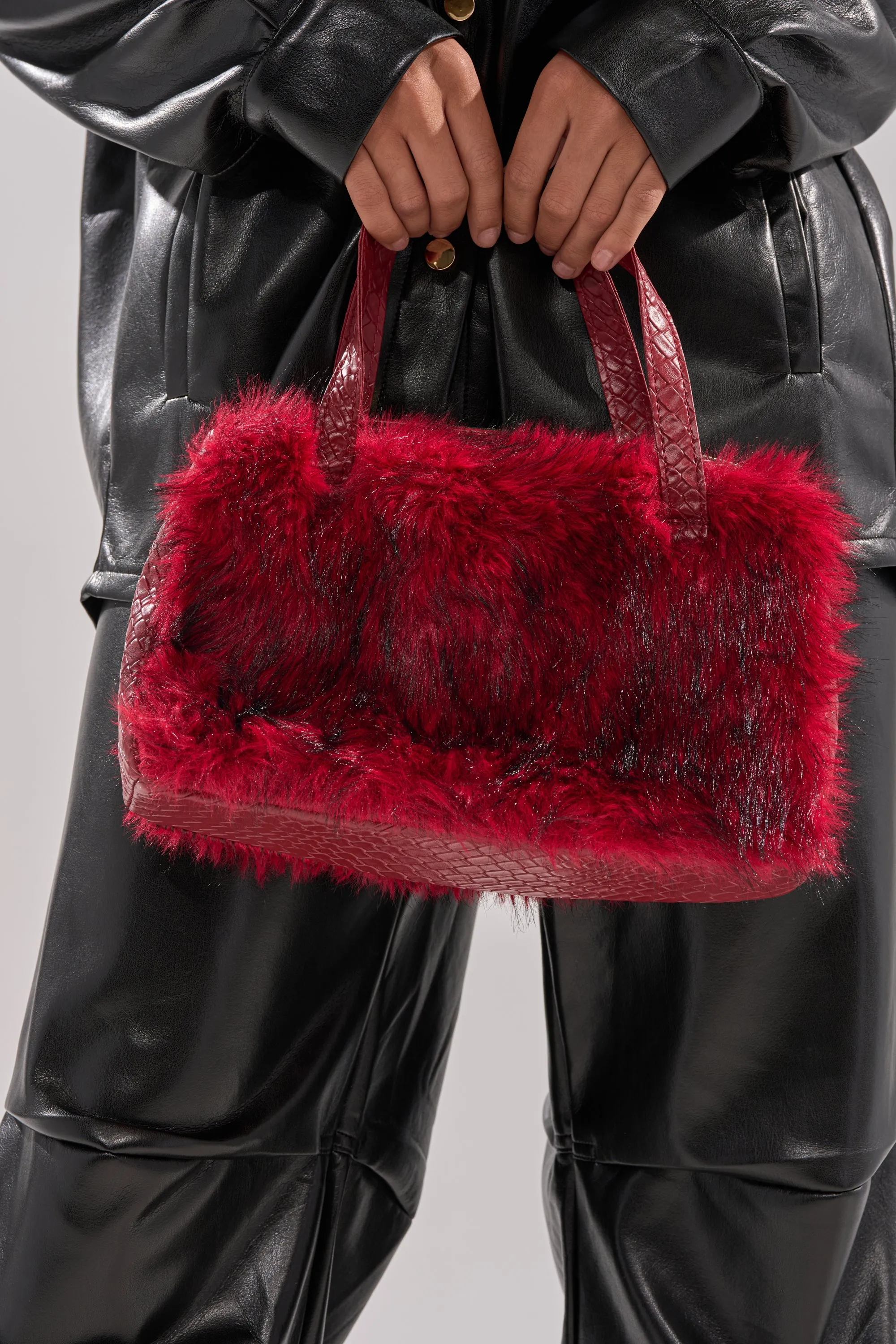 TRUDY FAUX FUR PURSE sold by AKIRA