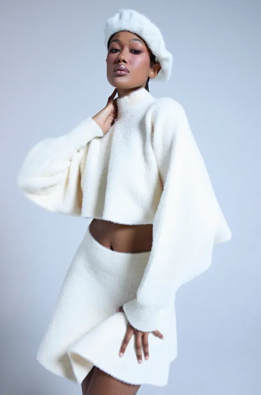 CUDDLE UP FUZZY CROPPED SWEATER IN IVORY sold by AKIRA