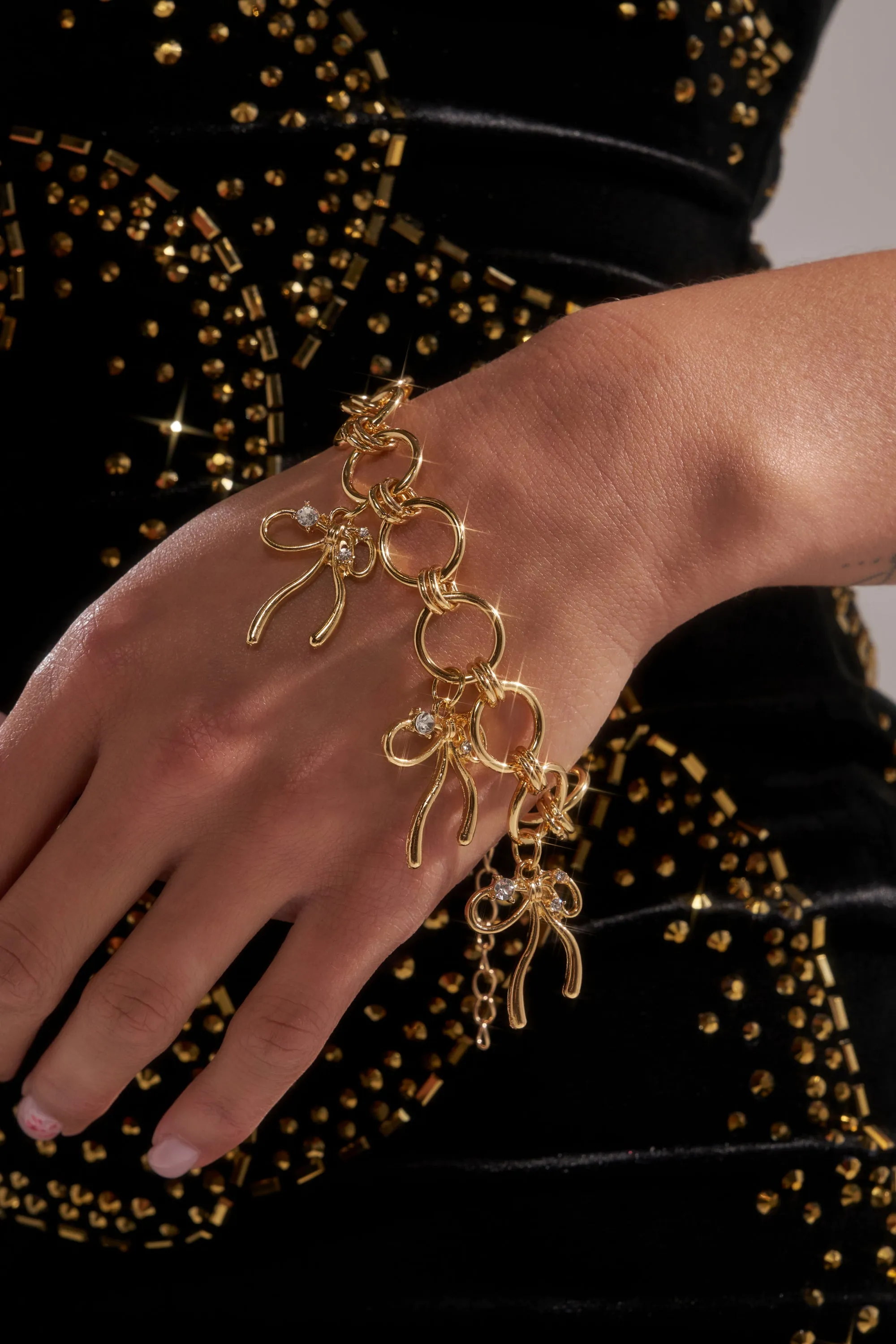 BOW TIME CHARM BRACELET sold by AKIRA