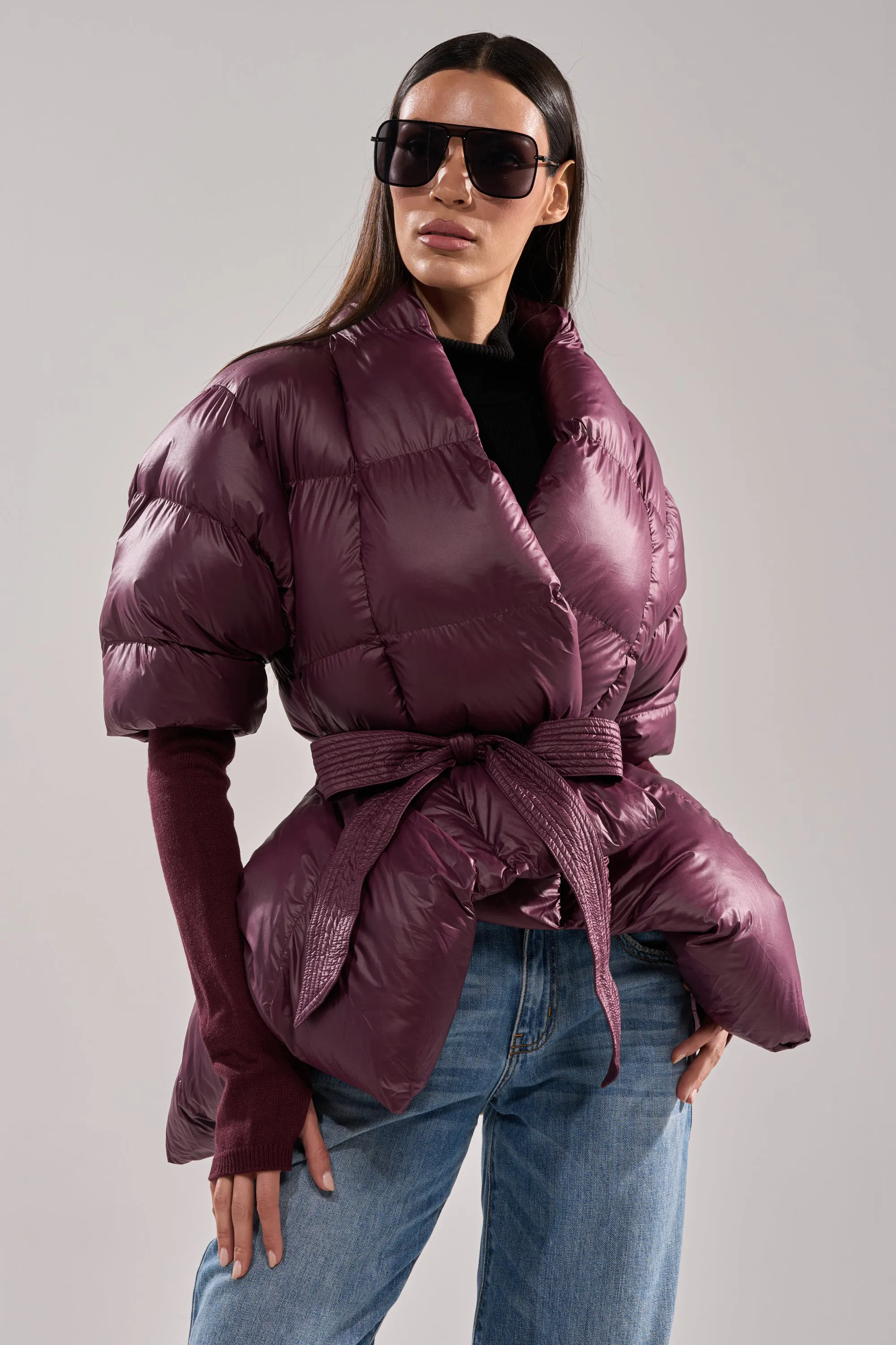 RIB SLEEVE PEPLUM PUFFER IN PURPLE sold by AKIRA