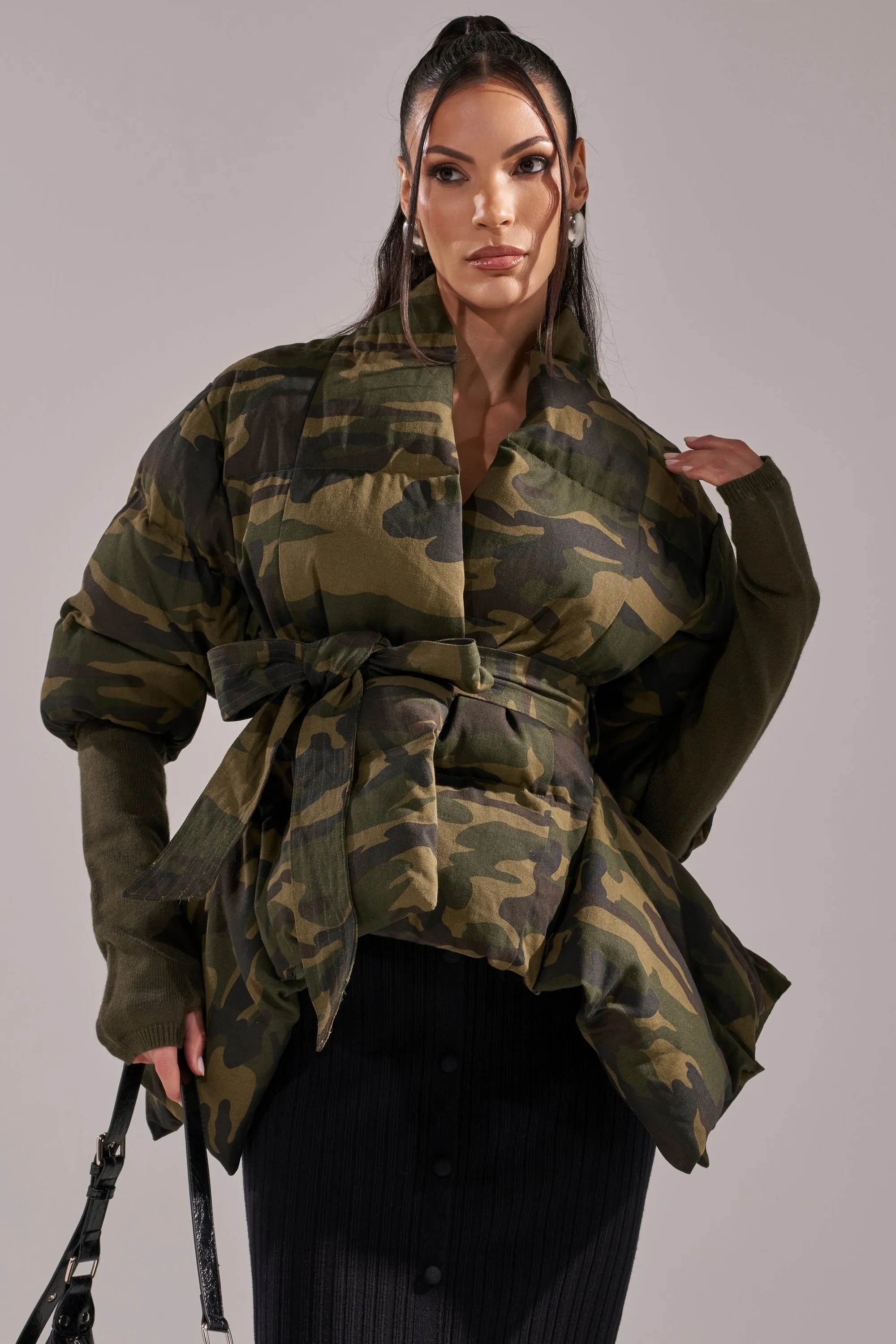 RIB SLEEVE PEPLUM PUFFER IN CAMO sold by AKIRA