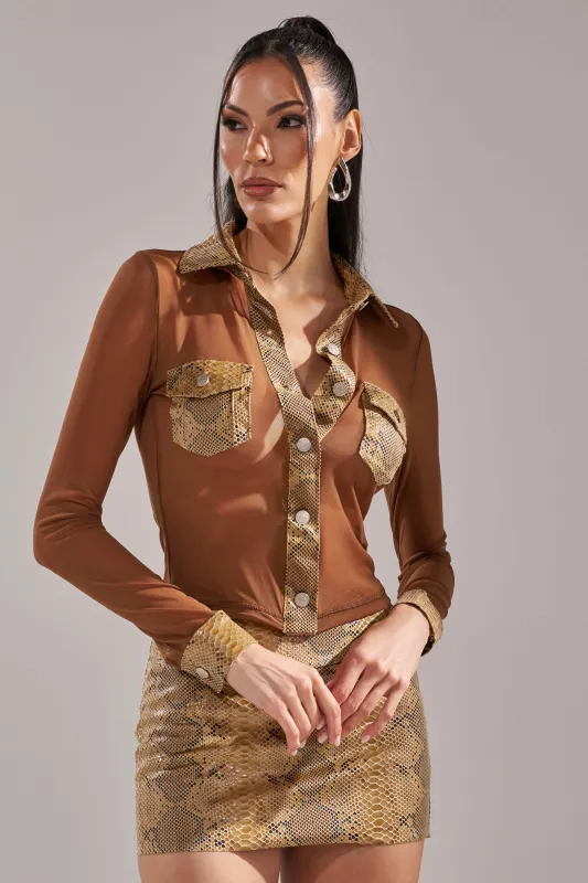 FEELING SOME TYPE OF WAY FAUX LEATHER SNAKE BUTTON DOWN sold by AKIRA