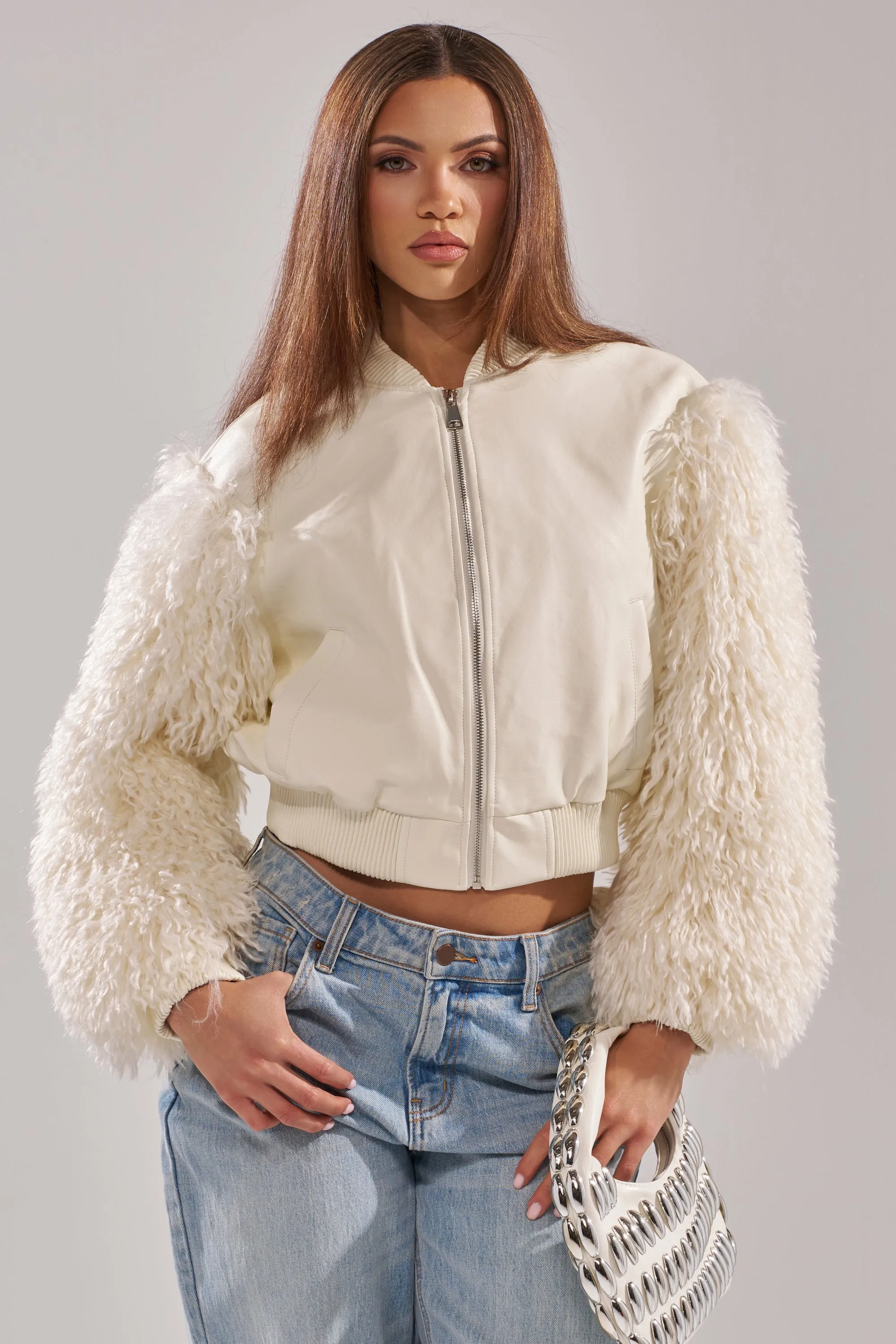 SO GOOD IT HURTS FUR SLEEVE BOMBER IN IVORY sold by AKIRA