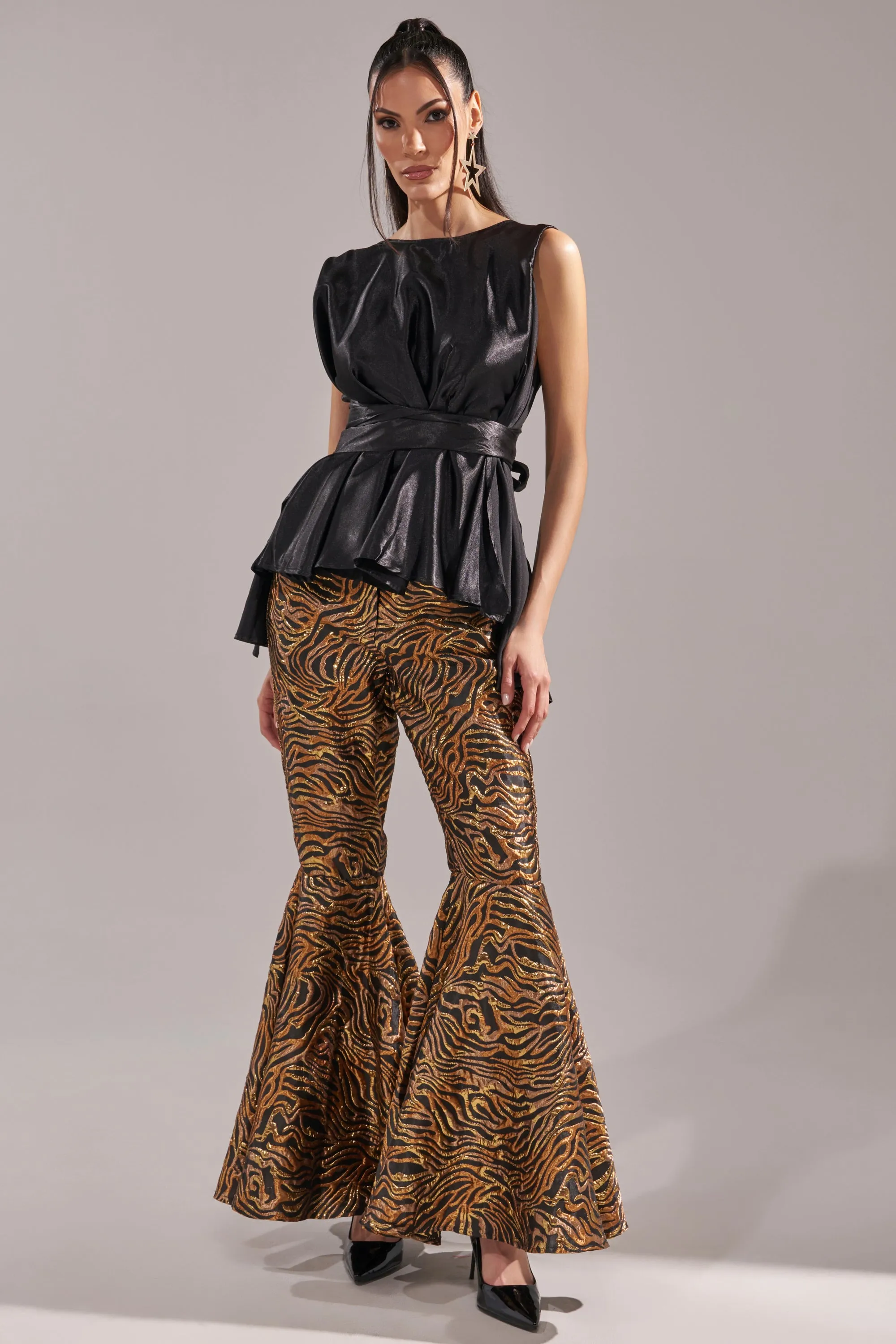 GET IN MOTION BROCADE FLARE TROUSER sold by AKIRA