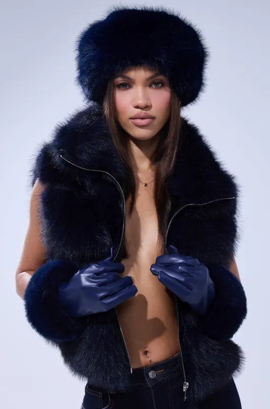 FAUX FUR VEST IN NAVY sold by AKIRA