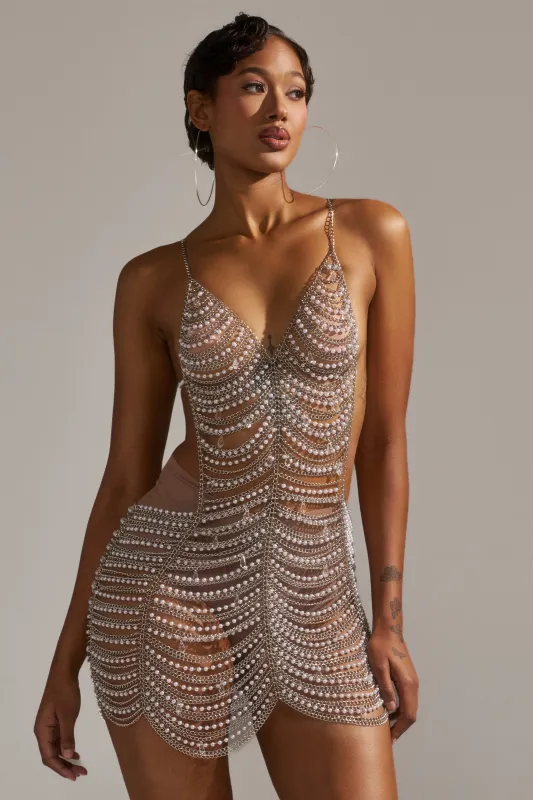 ITS GIVING DRAMA CHAIN MINI DRESS sold by AKIRA