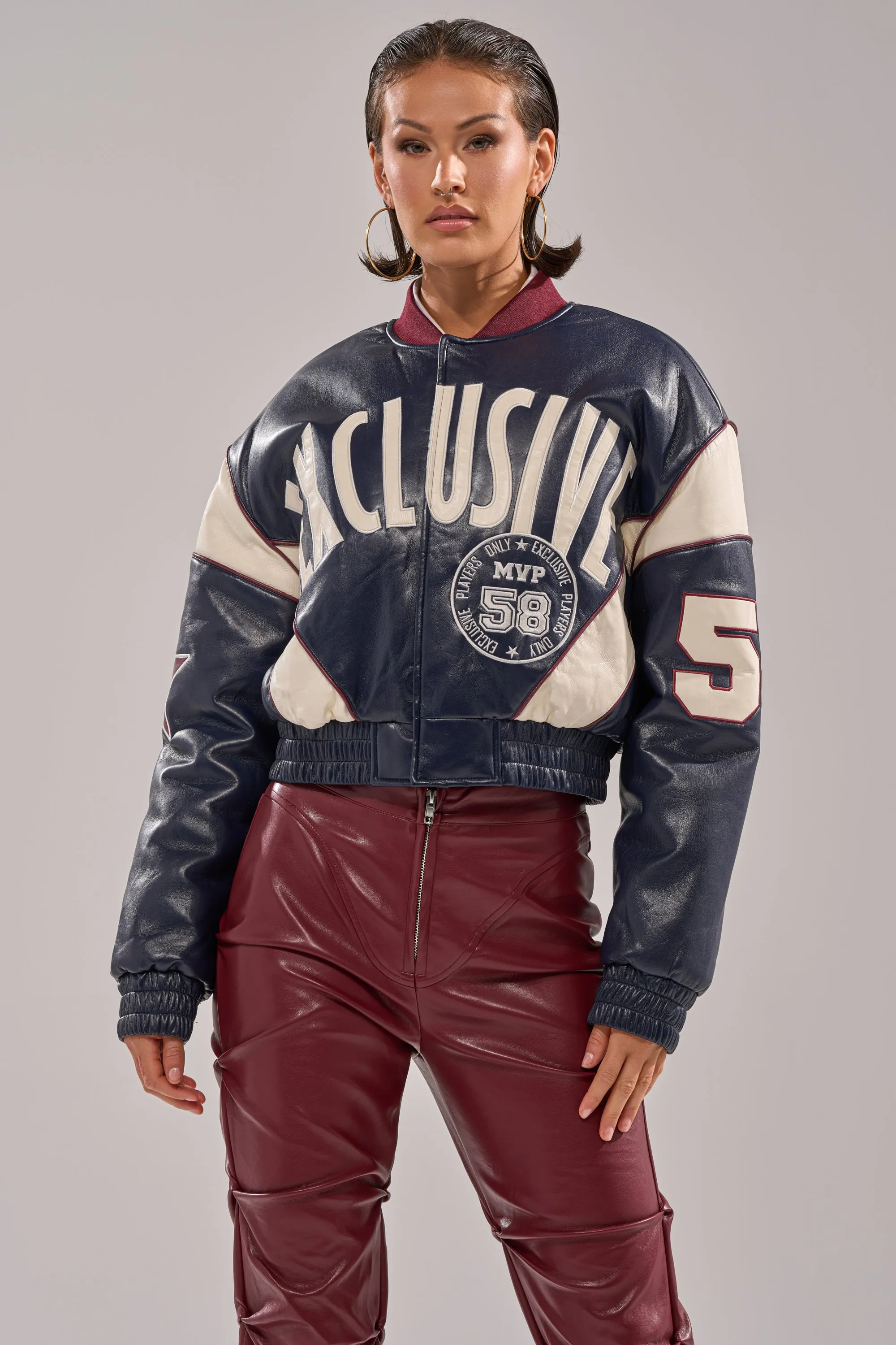 BUTTER LUXE VARSITY BOMBER sold by AKIRA