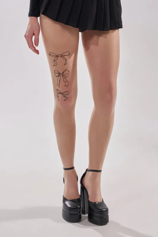 WRAP WITH A BOW TIGHTS sold by AKIRA