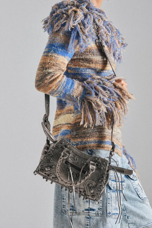 GRUNGE PIERCED PURSE made by AKIRA