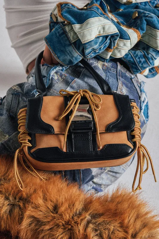 IN THE STREETS PURSE sold by AKIRA