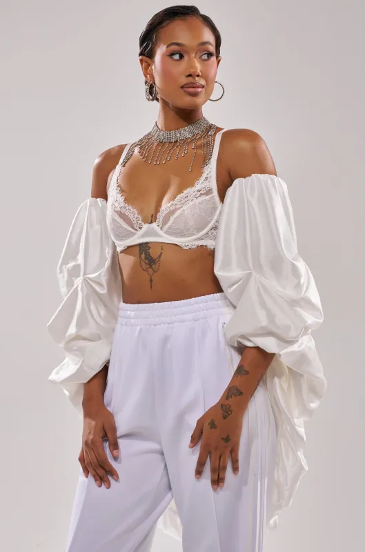 MORE THAN ENOUGH SATIN SHRUG IN WHITE sold by AKIRA