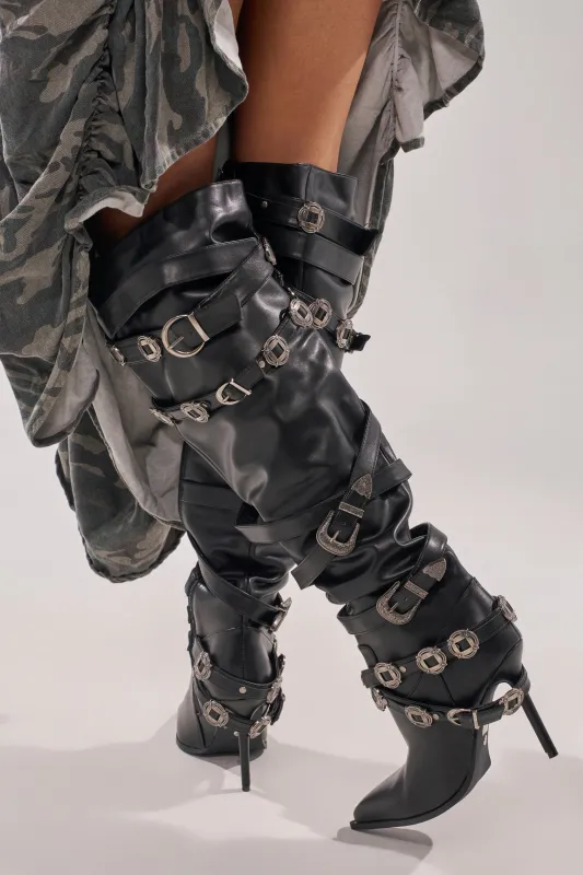 AKIRA GOLD XERXES BLACK STILETTO METAL EMBELLISHED BOOT sold by AKIRA