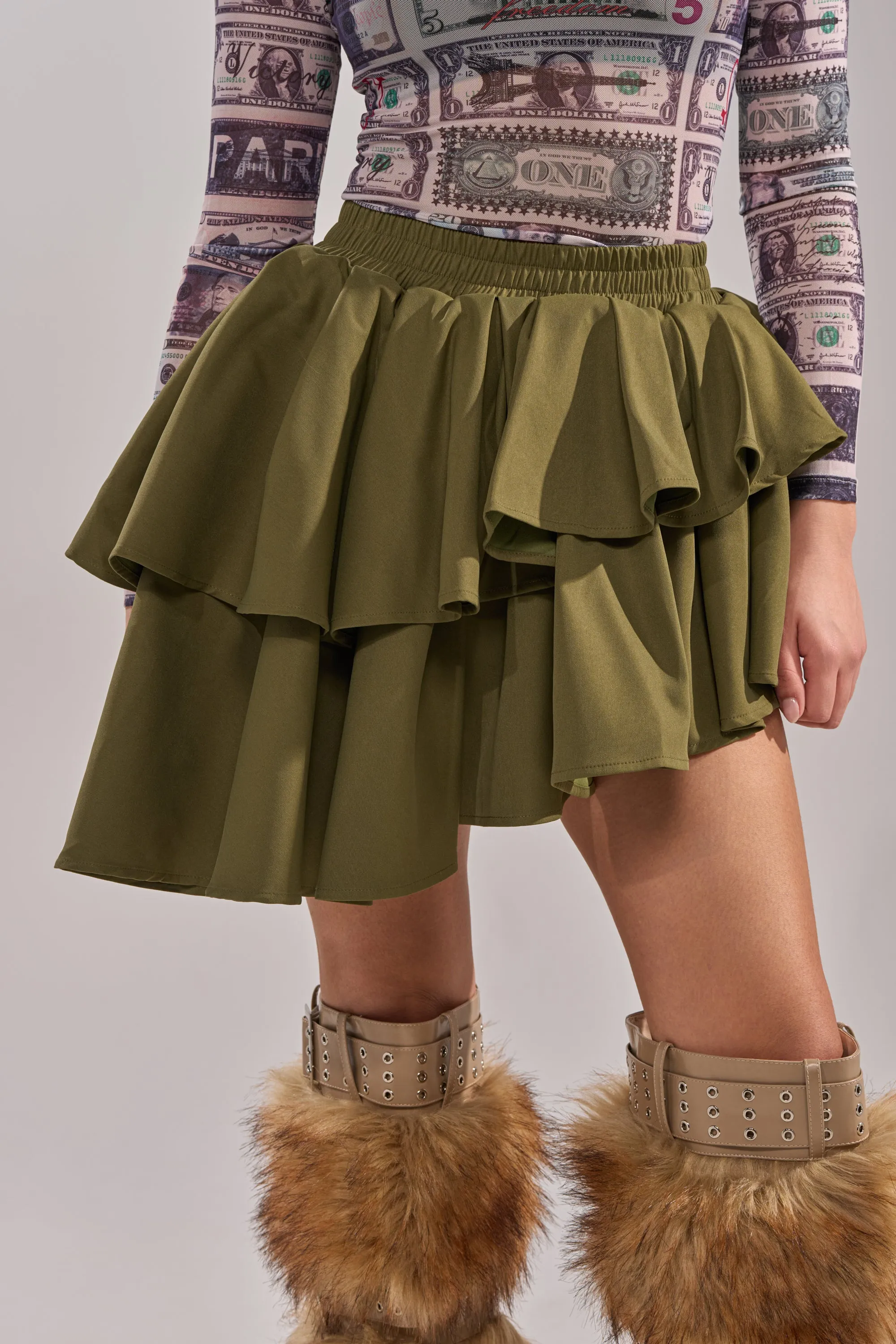 OLIVIA OLIVE MINI PLEATED SKIRT sold by AKIRA