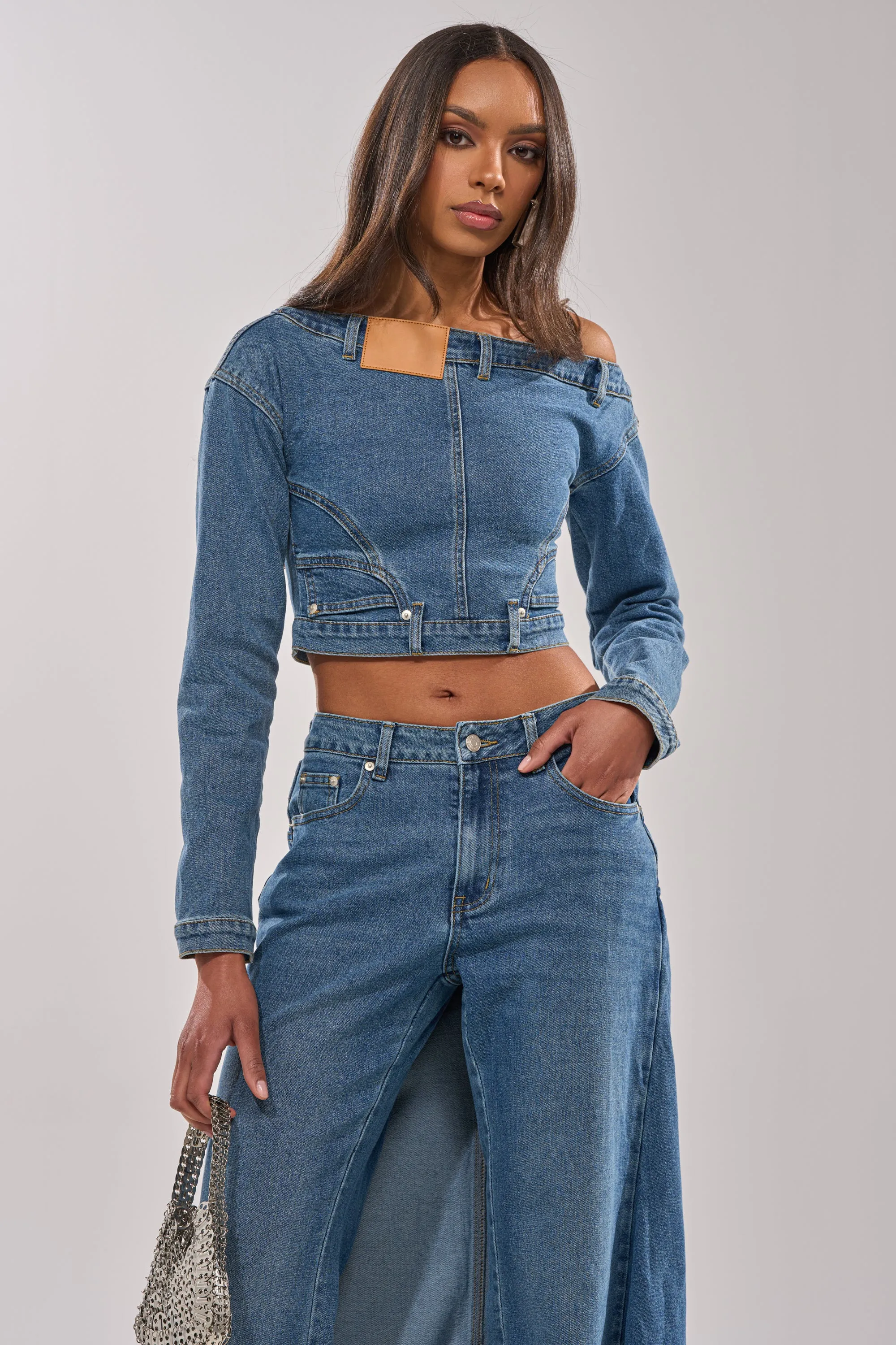 SHAKE IT OFF DENIM OFF THE SHOULDER TOP sold by AKIRA