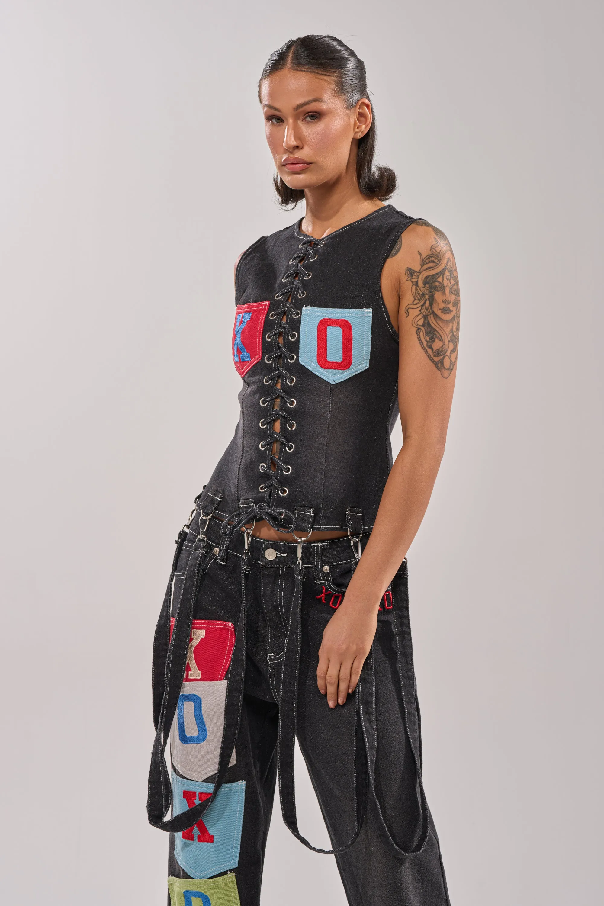 BRING IT BACK LACE UP DENIM TOP sold by AKIRA