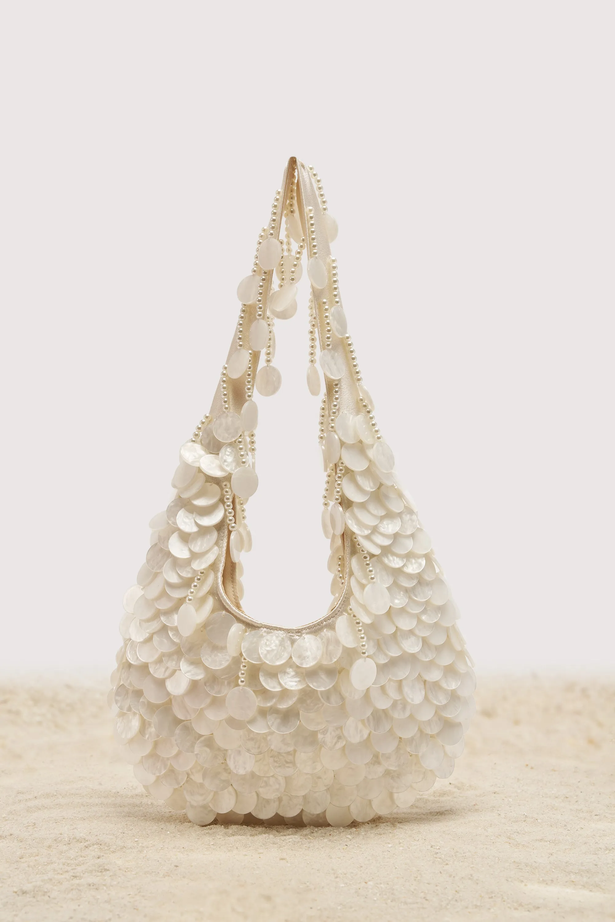 NO WORDS BEADED BAG IN WHITE sold by AKIRA