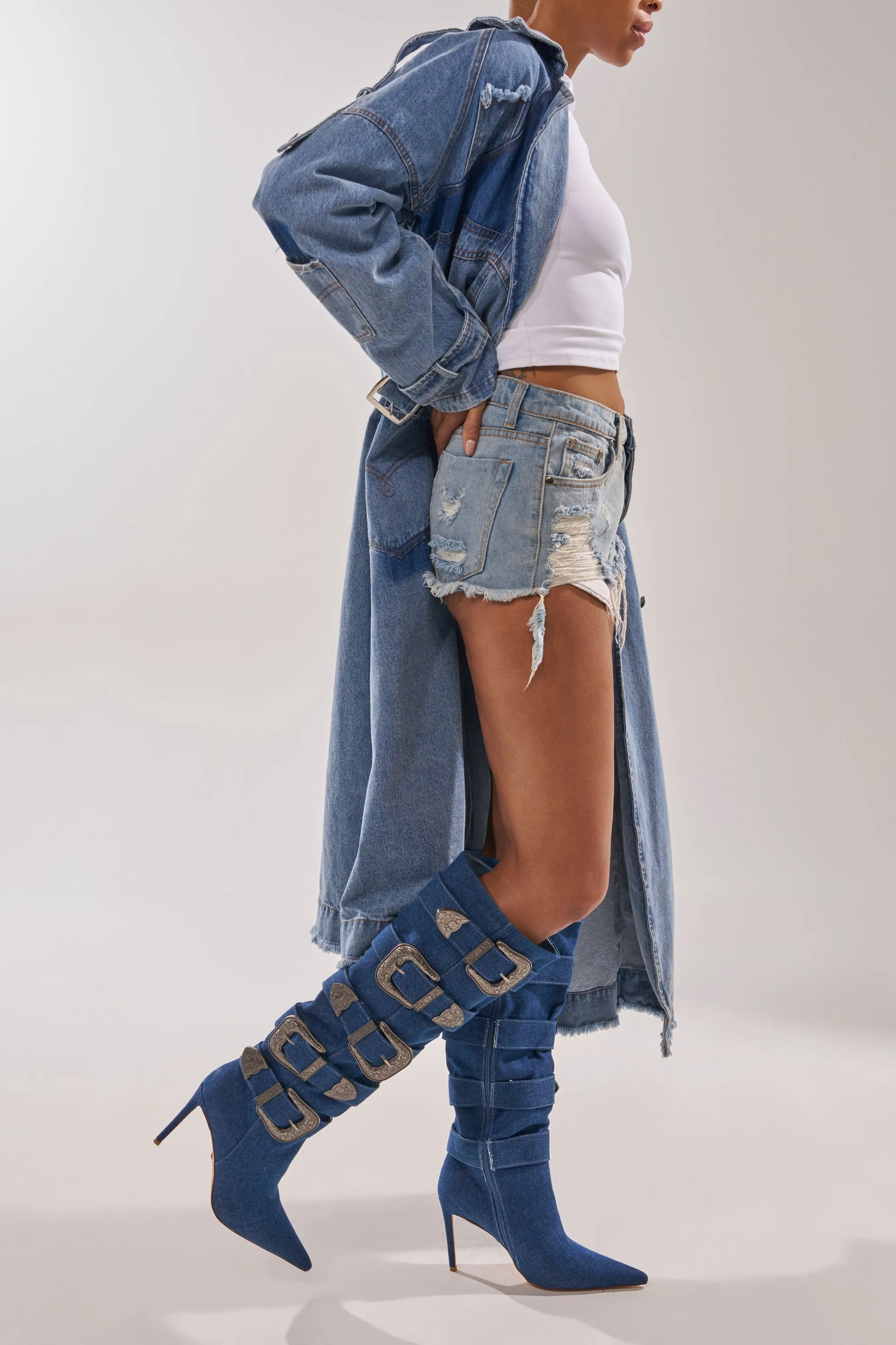 AKIRA GOLD FALLON DENIM BUCKLE EMBELLISHED STILETTO BOOT sold by AKIRA