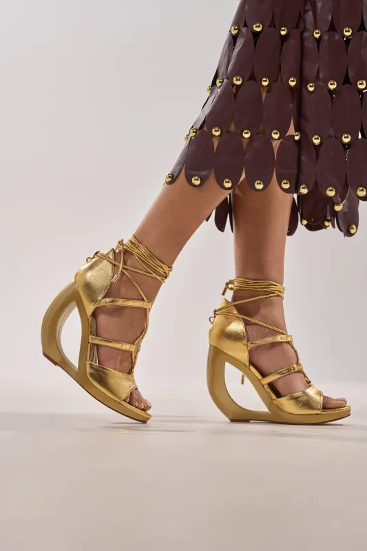 AKIRA GOLD RACHNA GOLD WEDGE OPEN TOE SANDAL sold by AKIRA