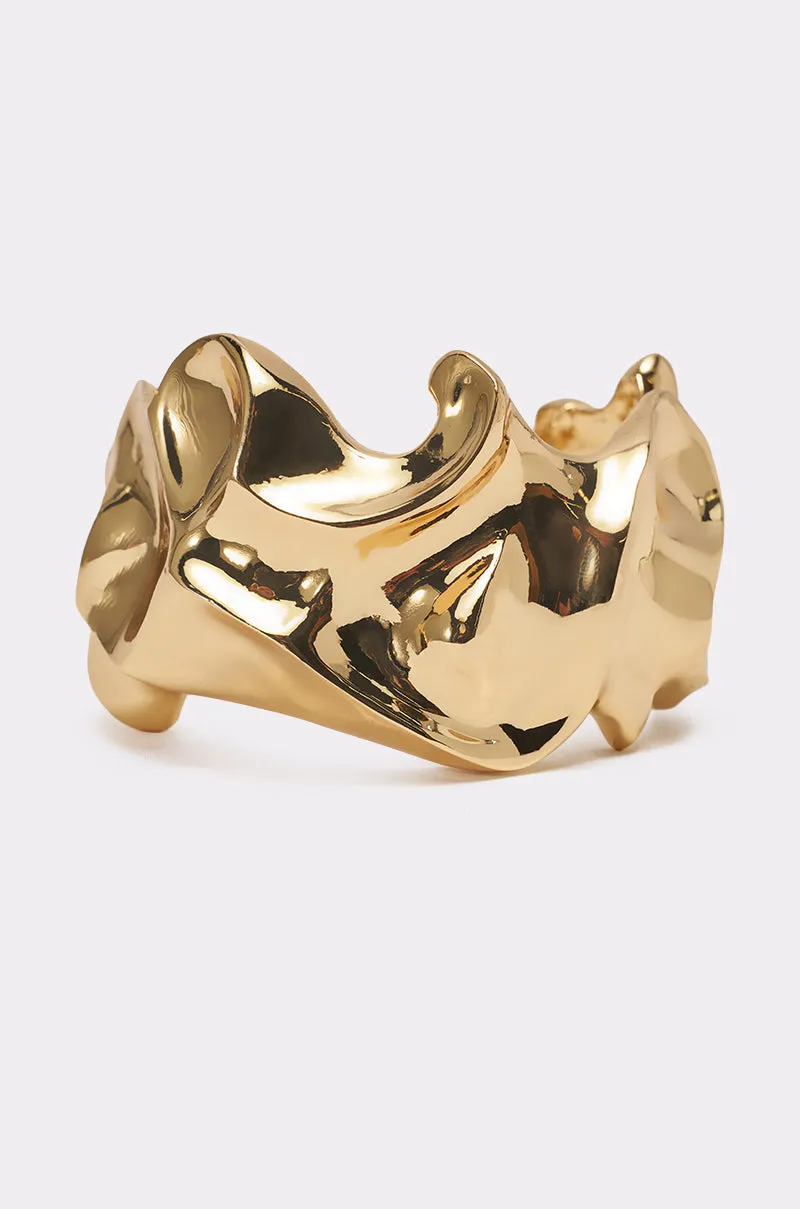 MOLTEN DREAMS BRACELET IN GOLD sold by AKIRA