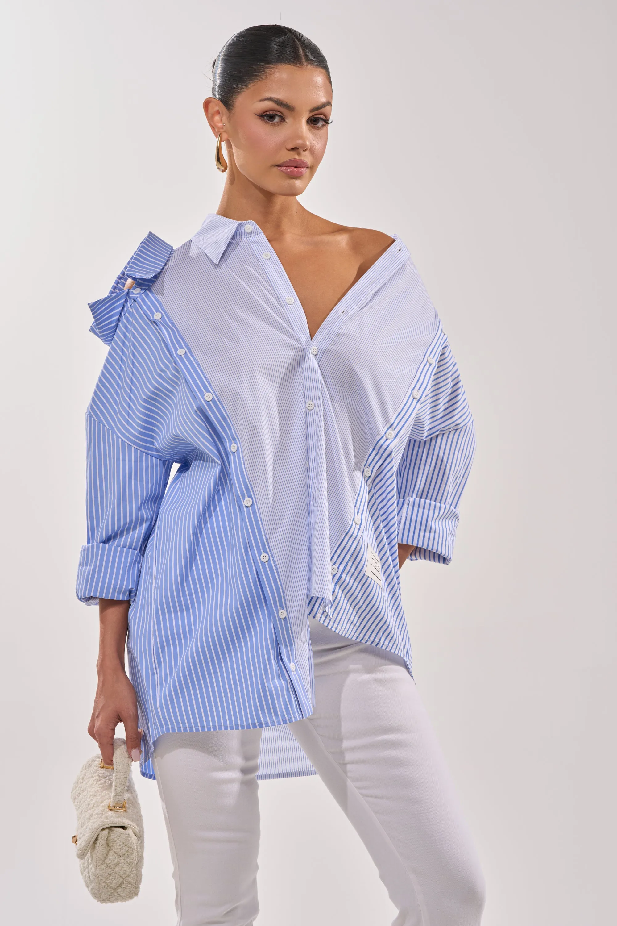 ALL OVER THE PLACE BLUE STRIPED BUTTON DOWN sold by AKIRA