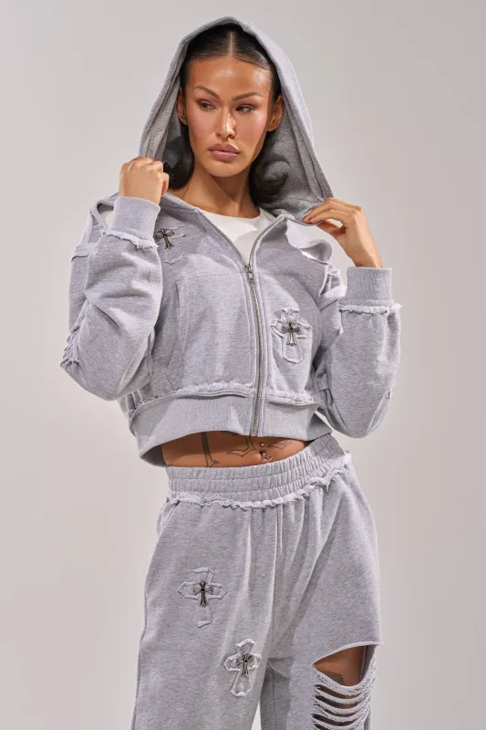 CROSSED OUT DISTRESSED ZIP UP SWEATSHIRT sold by AKIRA