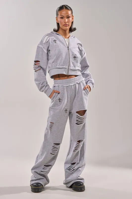 CROSSED OUT DISTRESSED WIDE LEG JOGGER made by AKIRA