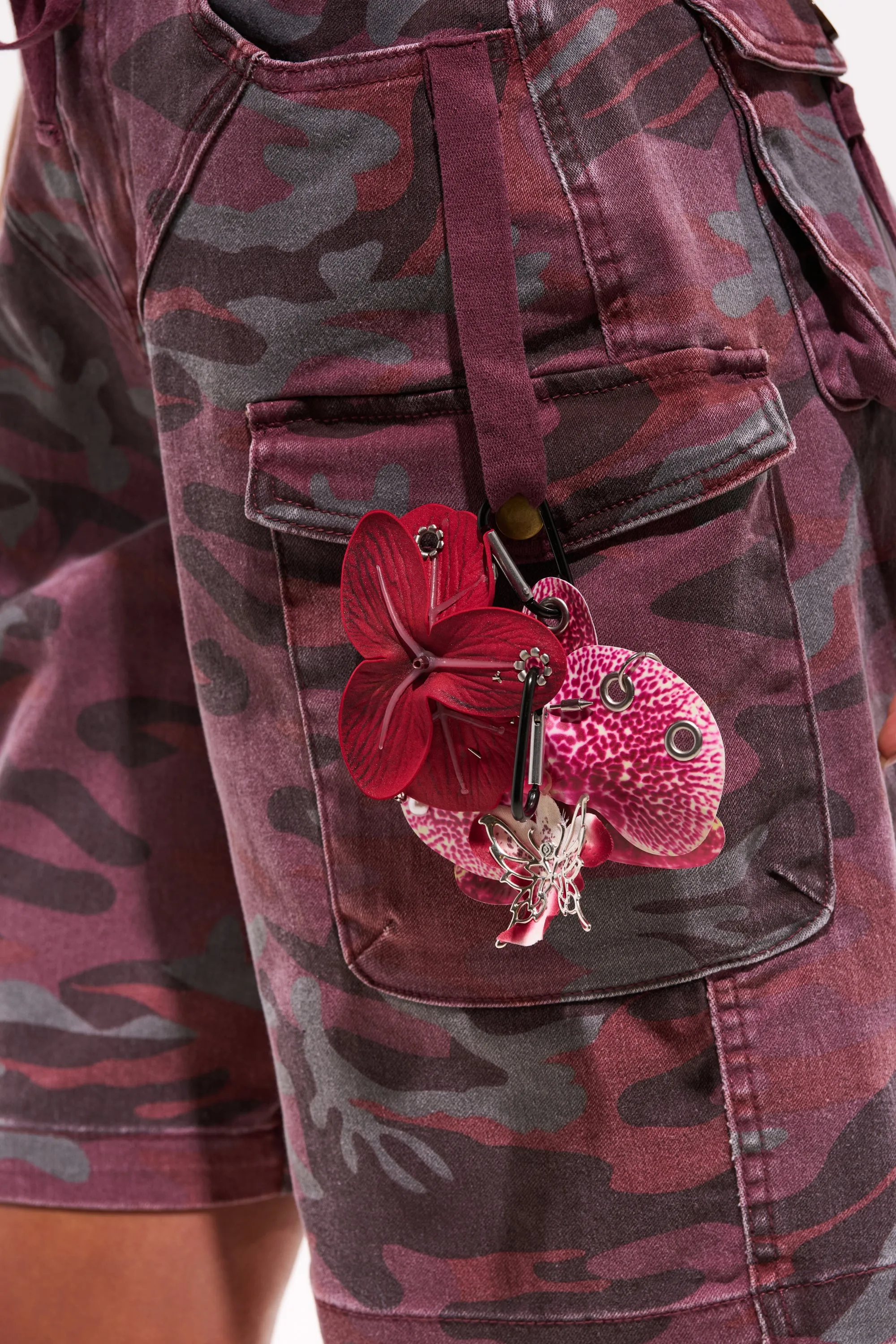 PIERCED ORCHID FLOWER KEYCHAIN SET sold by AKIRA