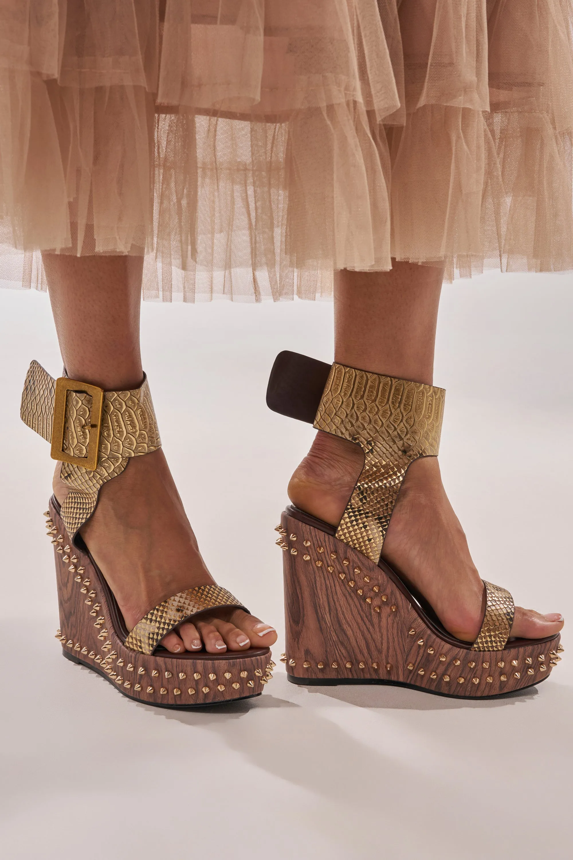 AKIRA GOLD SLOANE BROWN STUD AND SNAKE WEDGE SANDAL sold by AKIRA