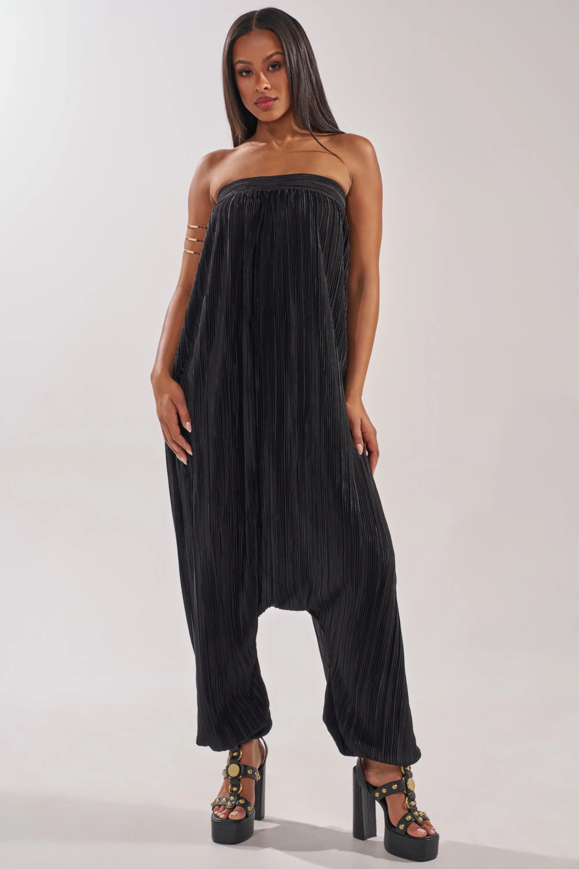 FROM THE CITY DROP CROTCH JUMPSUIT IN BLACK sold by AKIRA