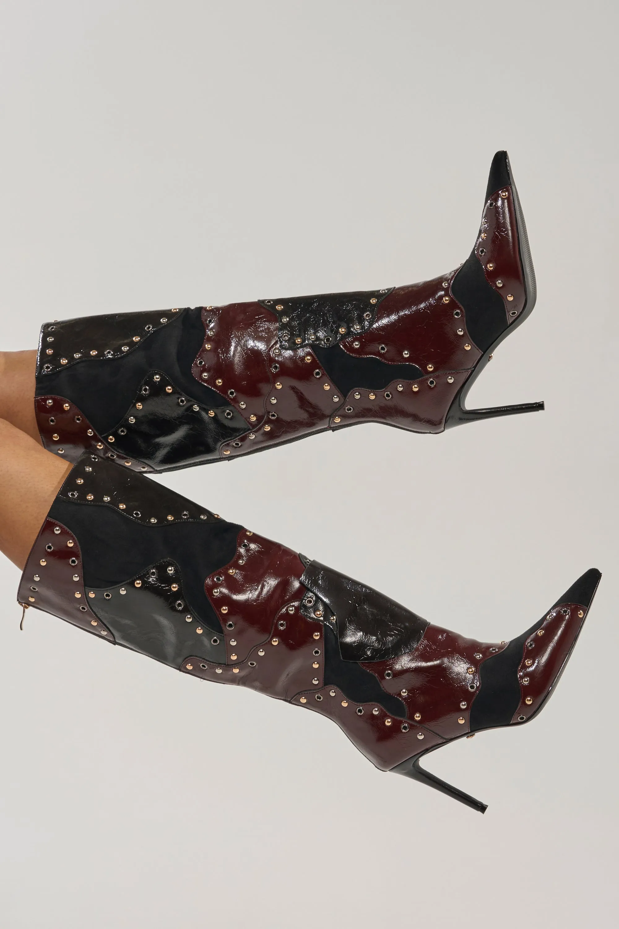 AKIRA GOLD ENYAE MAHOGANY MULTI PATCHWORK STILETTO BOOT sold by AKIRA