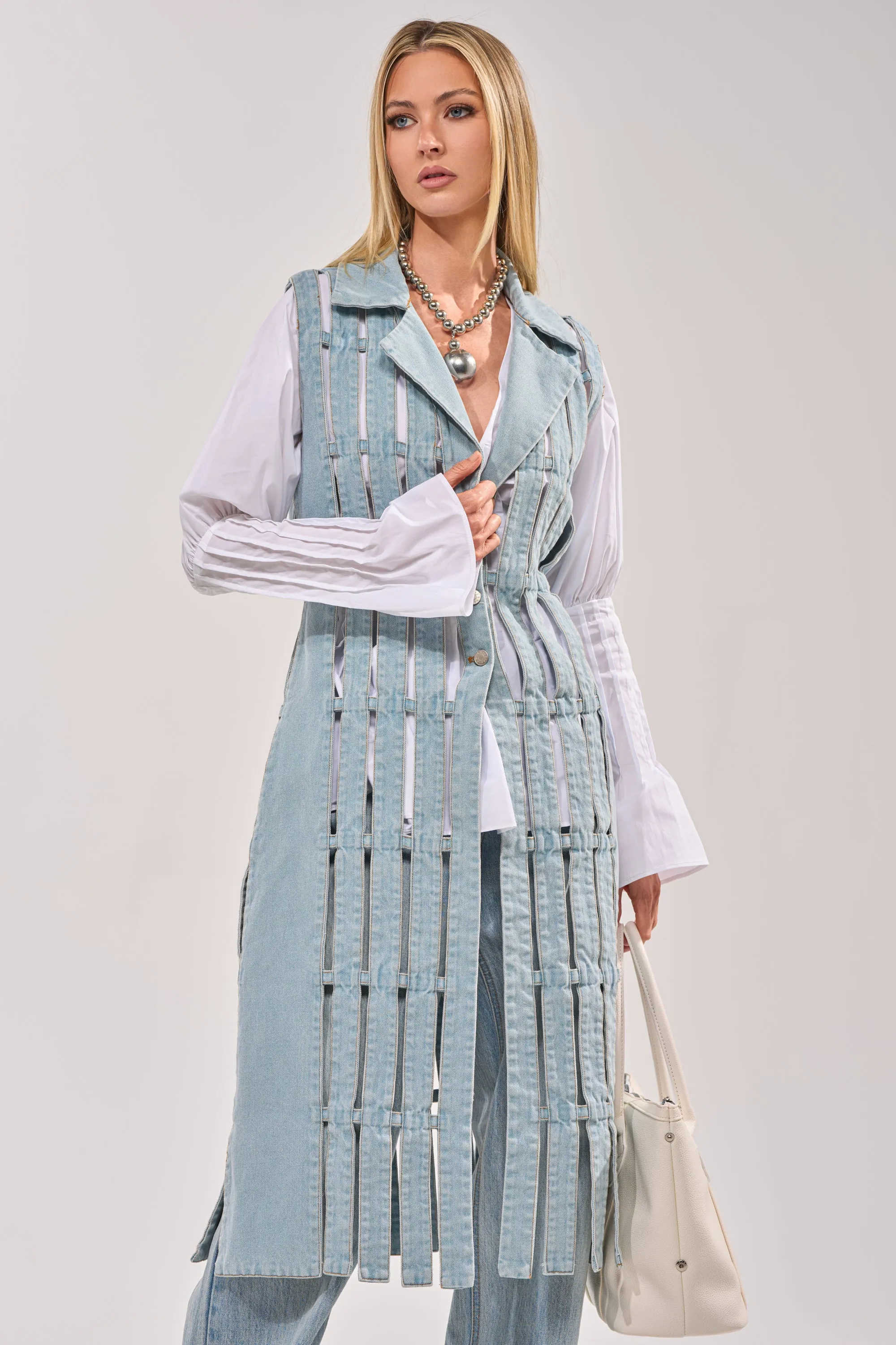 RIGHT THROUGH ME CUTOUT DENIM VEST sold by AKIRA