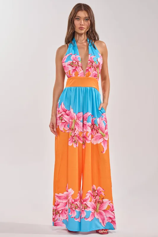 ON VACA TIME HALTER FLORAL PRINT JUMPSUIT made by AKIRA
