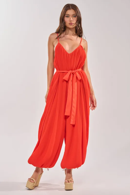 VACATIONING PLEATED JUMPSUIT IN ORANGE made by AKIRA