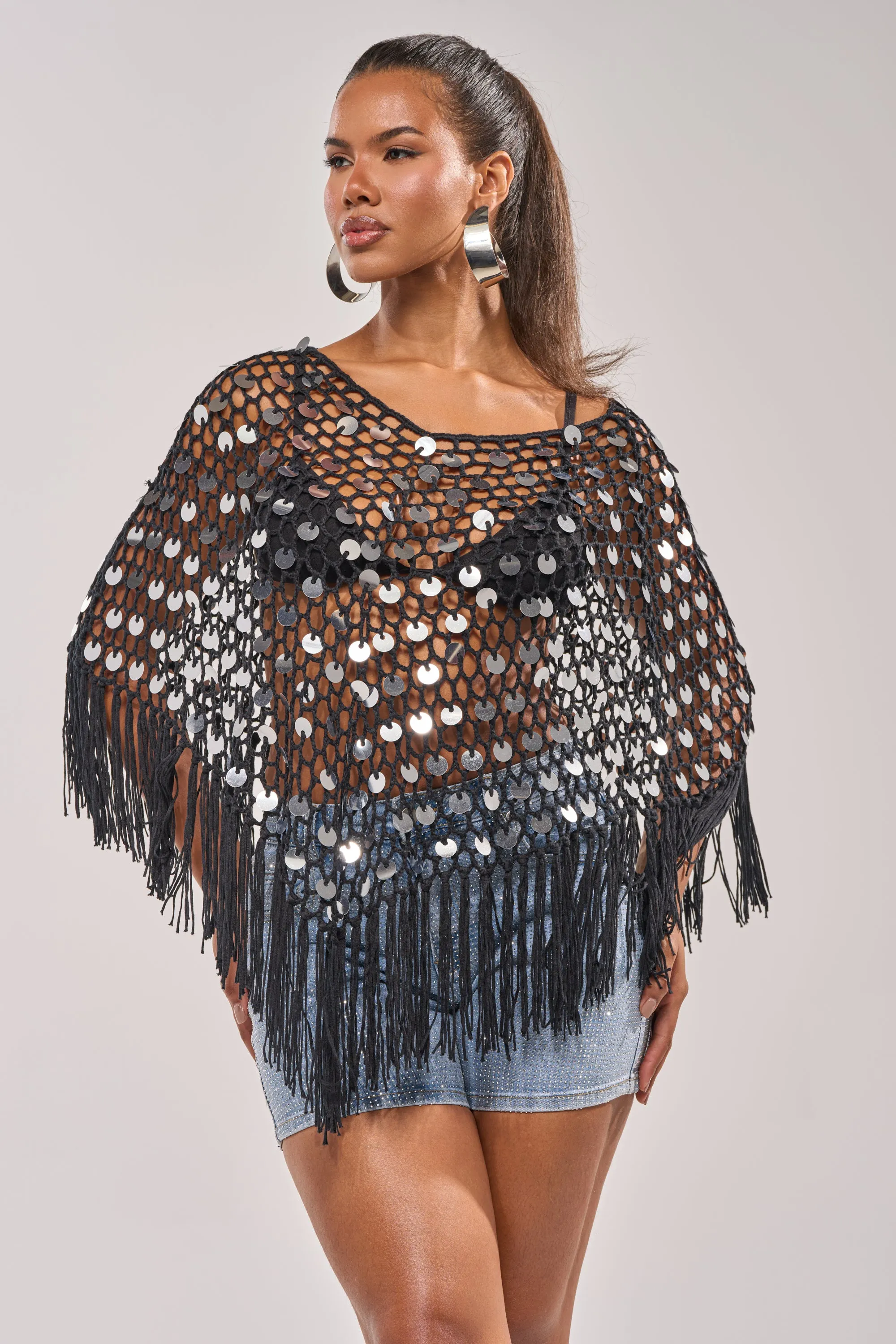 UNDER THE LIGHTS CROCHET SEQUIN PONCHO sold by AKIRA