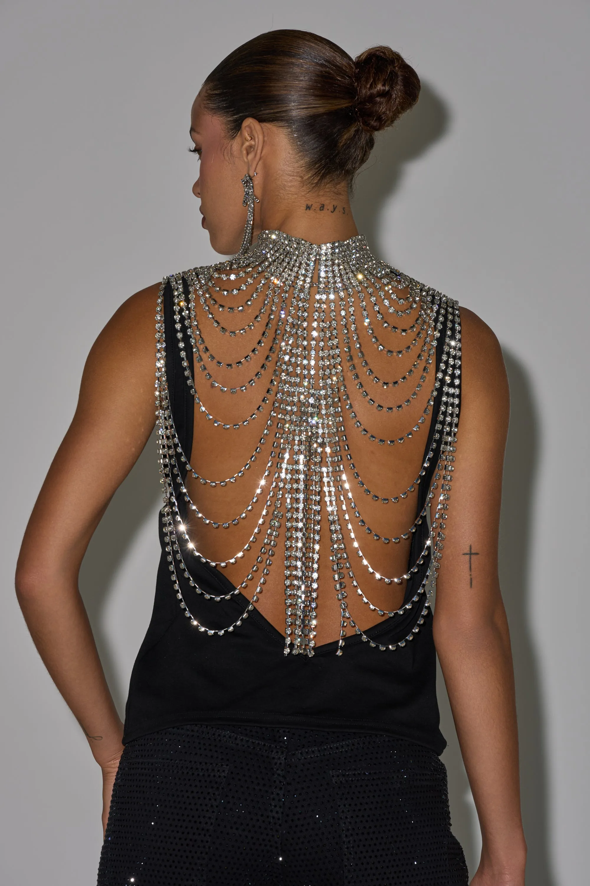 ONE OF ONE RHINESTONE SLEEVELESS TEE IN BLACK sold by AKIRA
