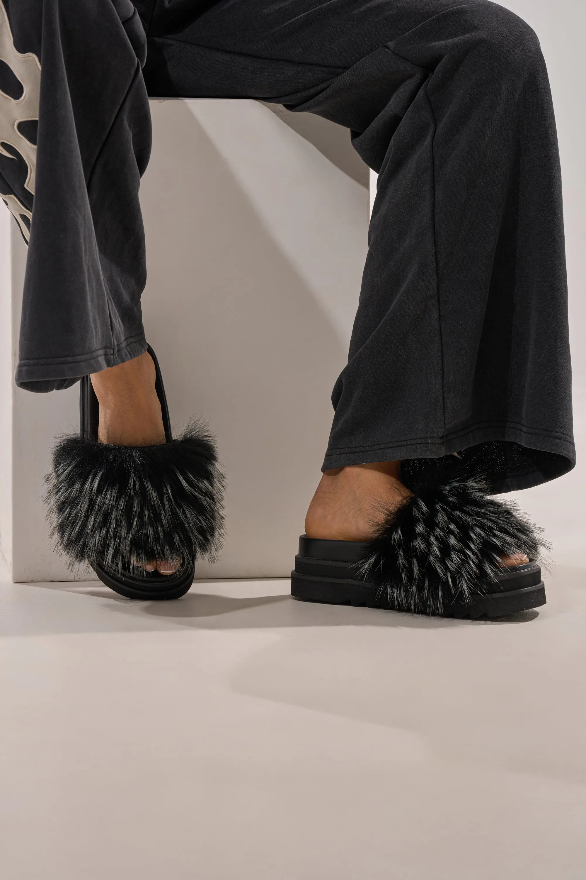 AKIRA MIRAY BLACK MULTI BLACK FUR SLIDE sold by AKIRA