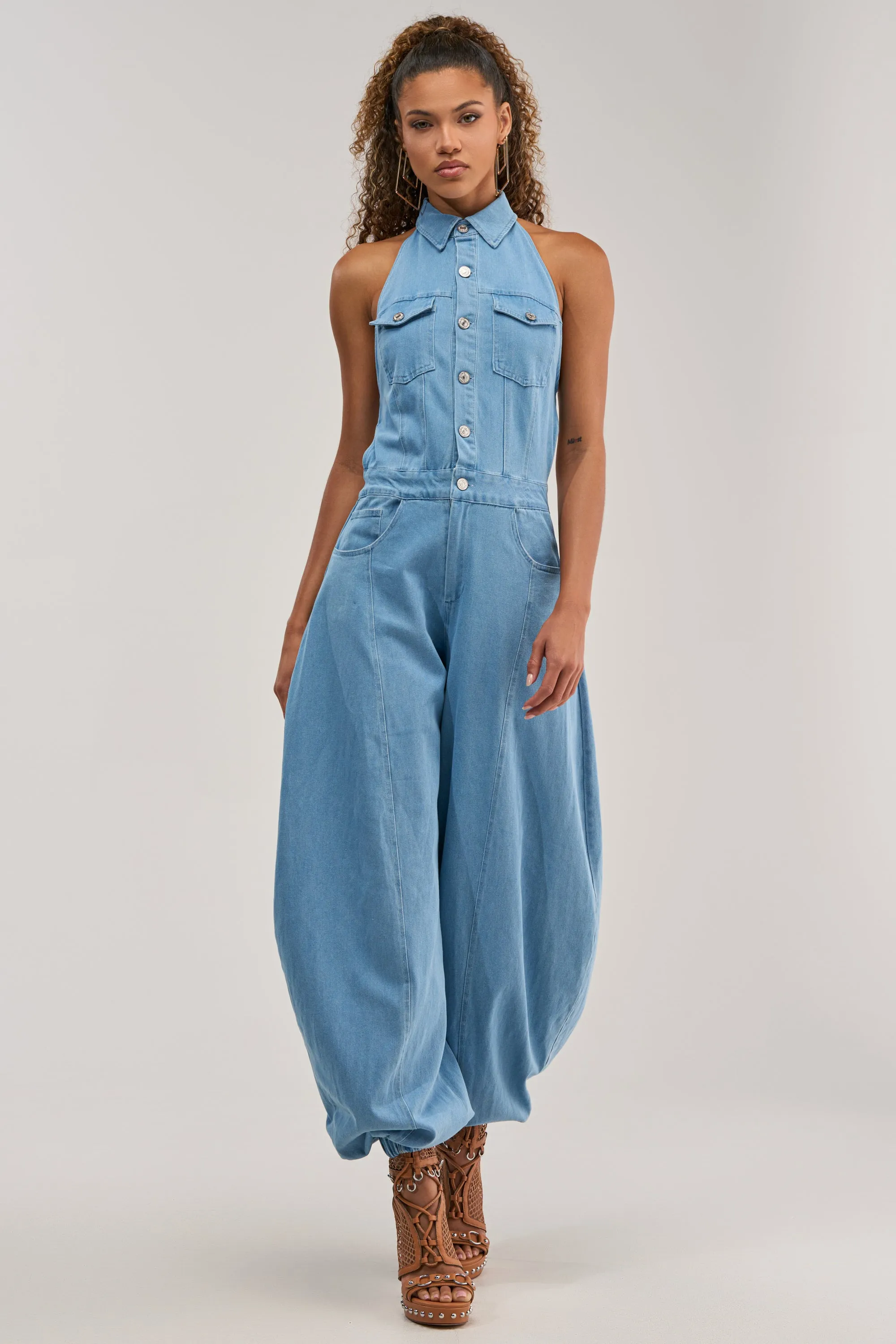 JETSETTER JUMPSUIT IN LIGHT BLUE DENIM sold by AKIRA
