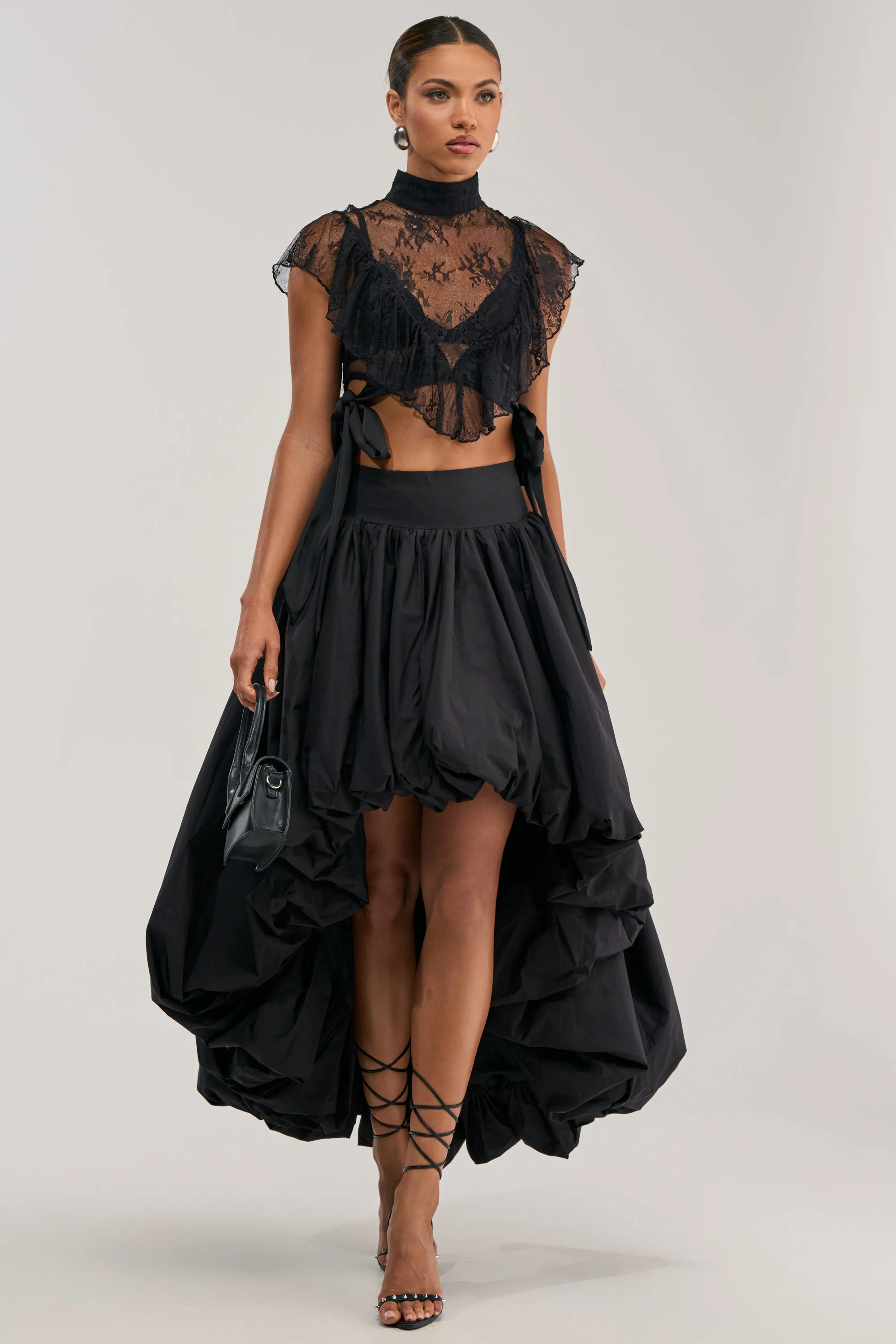 THE BIGGER THE BETTER HIGH LOW MAXI SKIRT IN BLACK sold by AKIRA