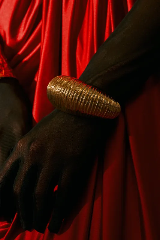 LOUDER NOW OVERSIZED BANGLE IN GOLD made by AKIRA