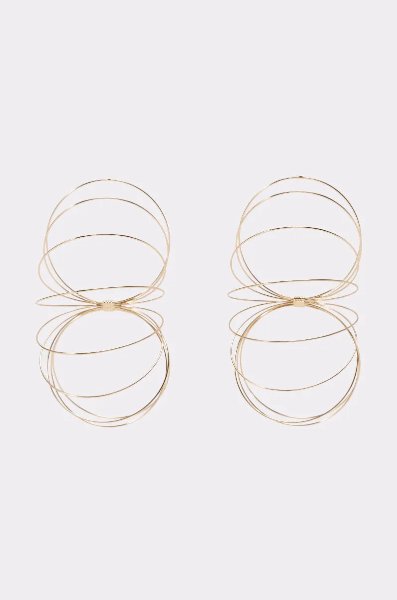 GOLD SLINKY EARRINGS sold by AKIRA