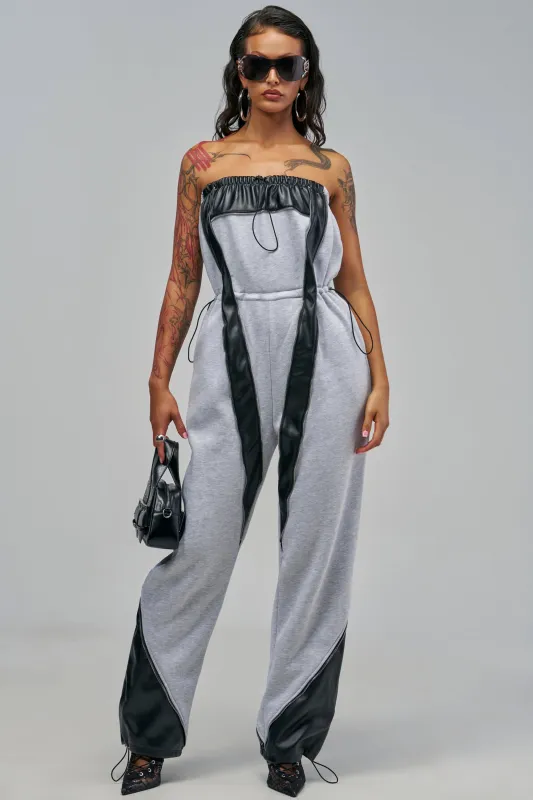 SHE RUNS IT STRAPLESS JUMPSUIT made by AKIRA